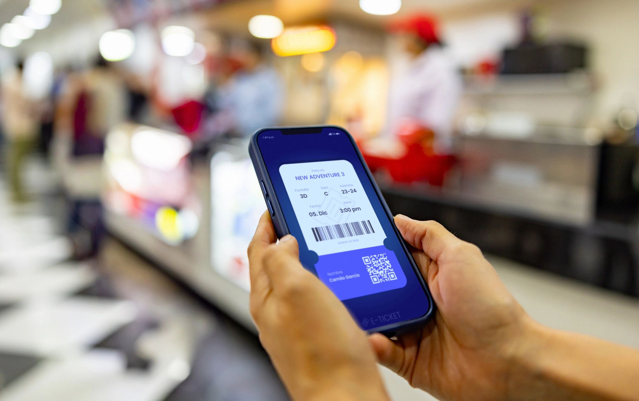 Person viewing a mobile event ticket QR code on a smartphone