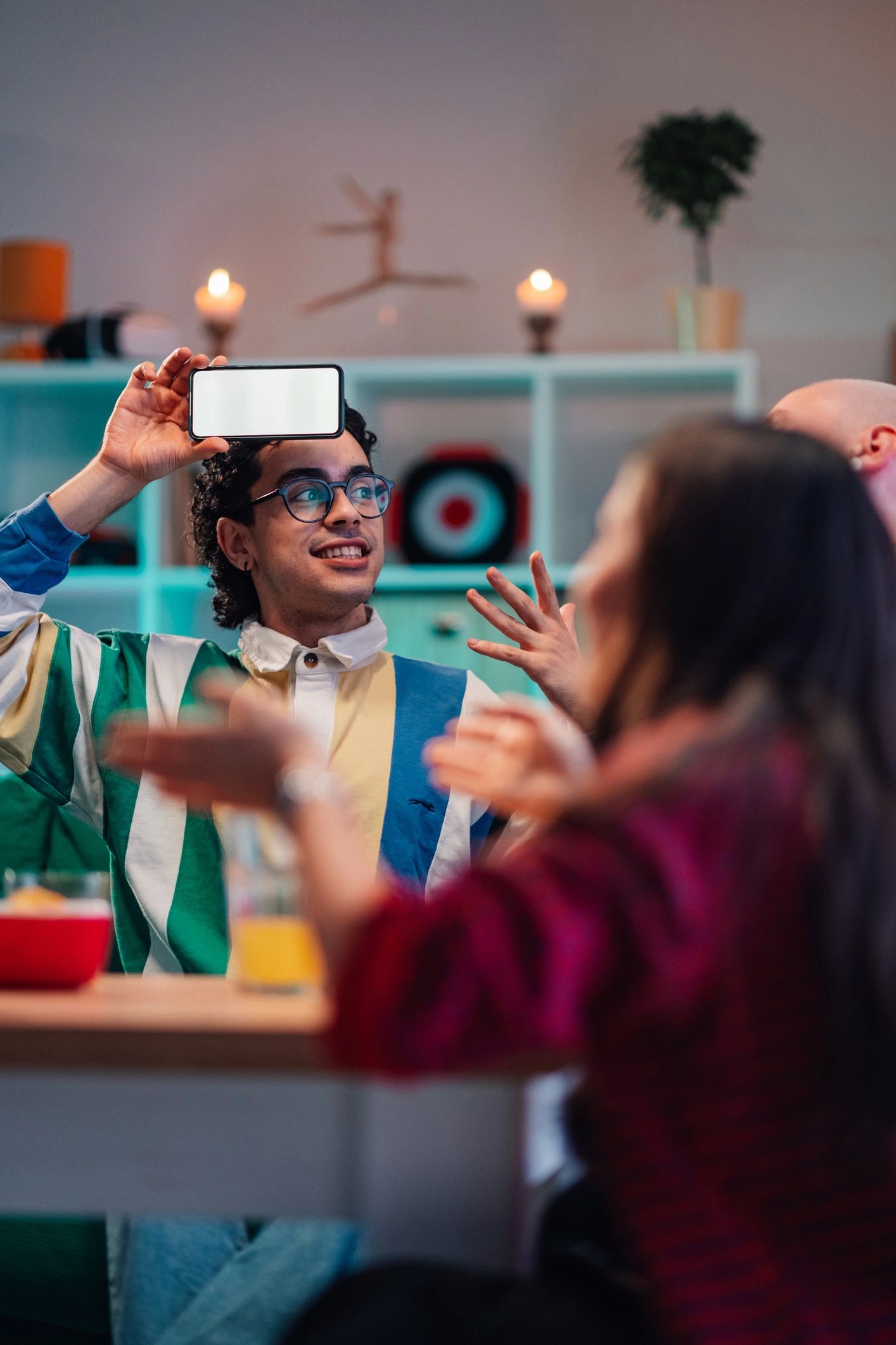 Friends using a smartphone together during a social event